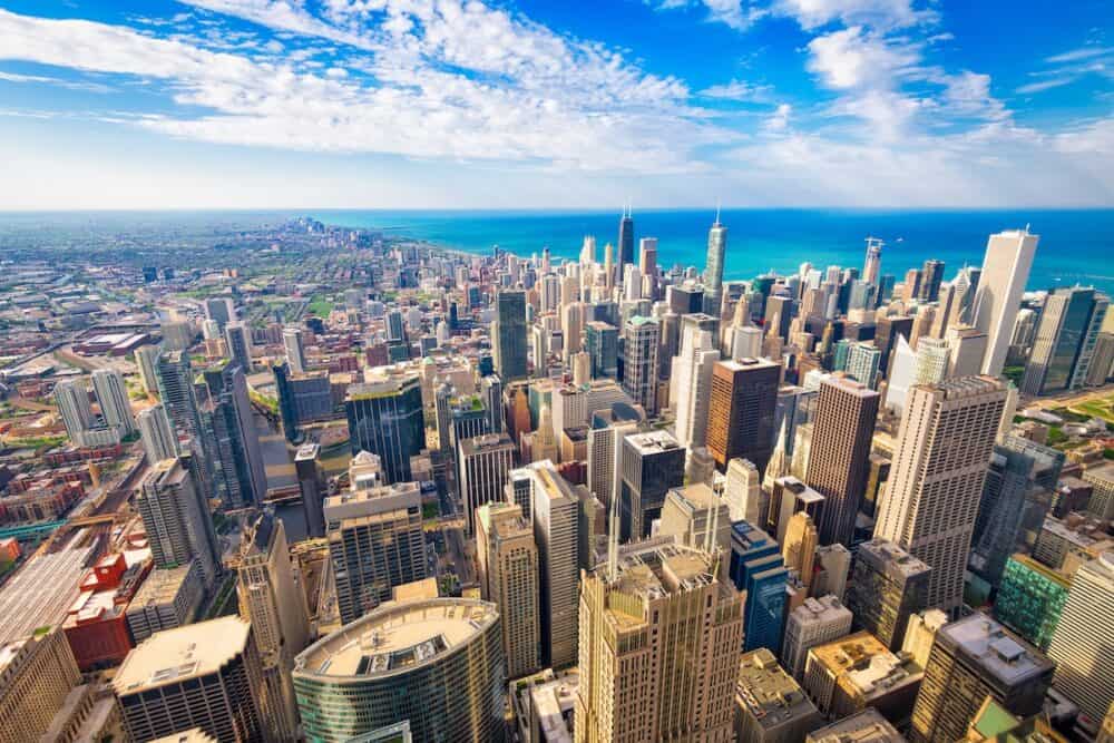 Chicago, Illinois, USA aerial downtown skyline at dusk towards Lake Michigan.