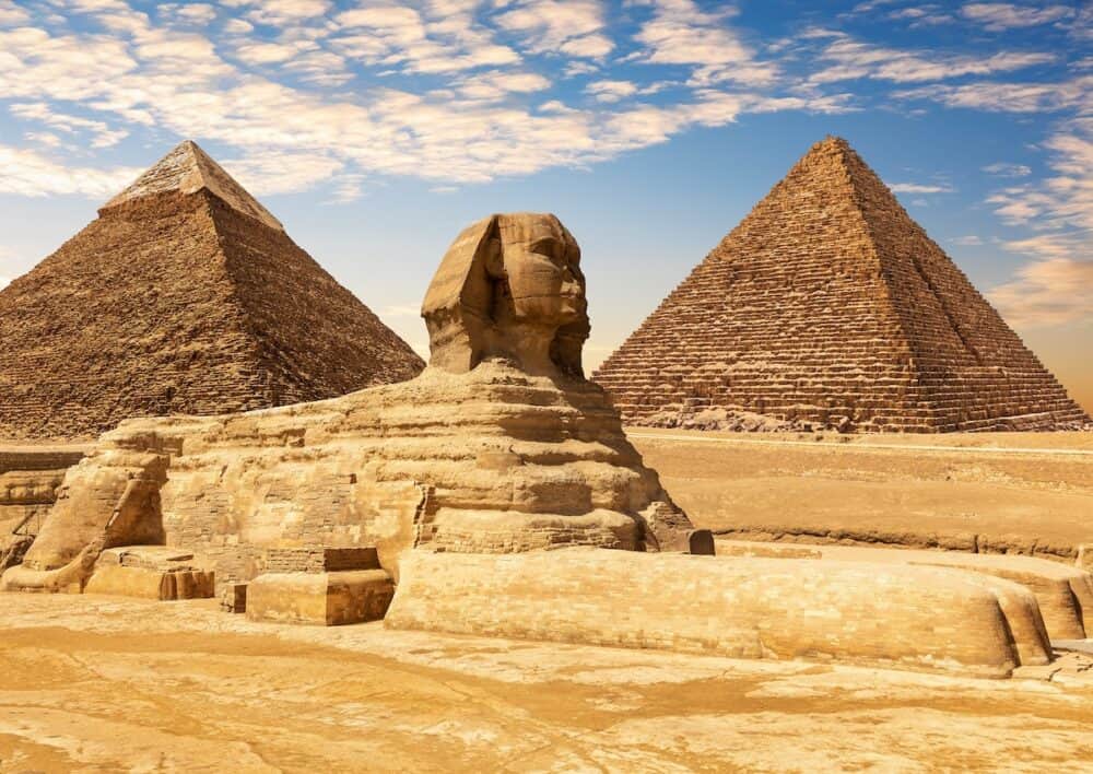 The Great Sphinx between the Khafre and Menkaure Pyramids of Giza, Cairo, Egypt