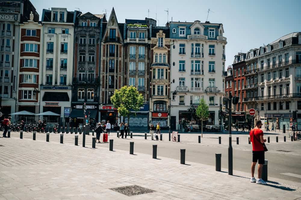 Vibrant cityscape of old town Lille, France, showcasing historic townhouses and lively urban atmosphere.